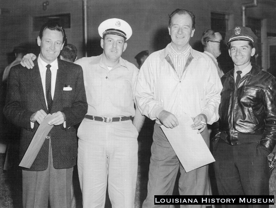 William Holden (L), Mike Fisher (R) standing next to John Wayne